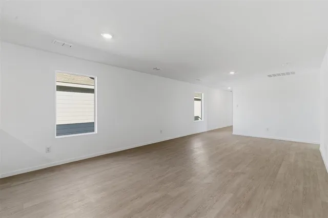 an empty room with a empty space and window