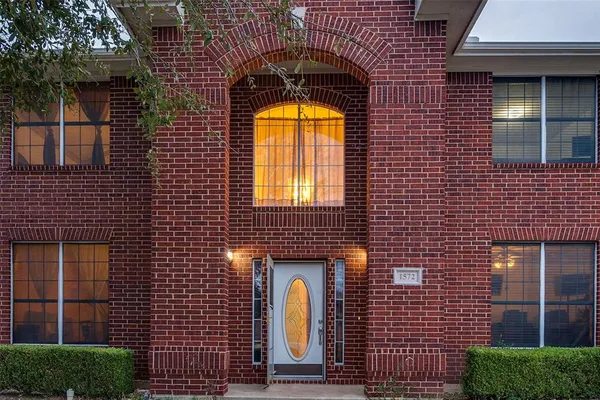a front view of a house with a glass door