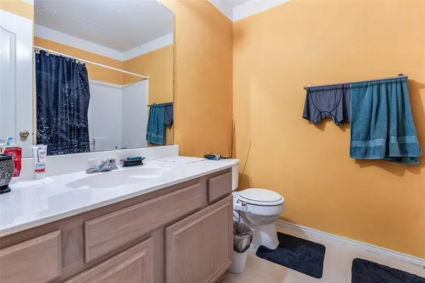 a bathroom with a sink and a toilet