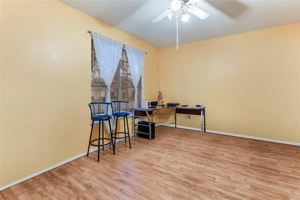 a view of a livingroom with furniture and wooden floor