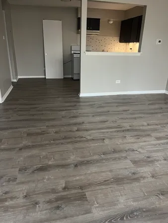 a view of a livingroom with wooden floor