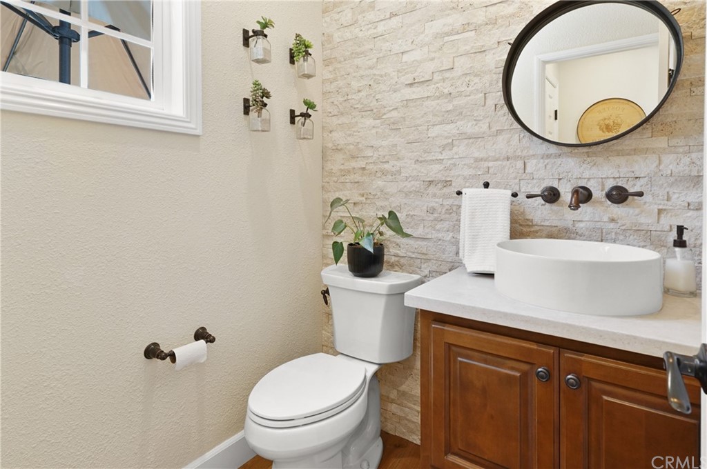 56 Tuberose Street Ladera Ranch, CA 92694 - Photo 11 of 55 a bathroom with a sink and a mirror