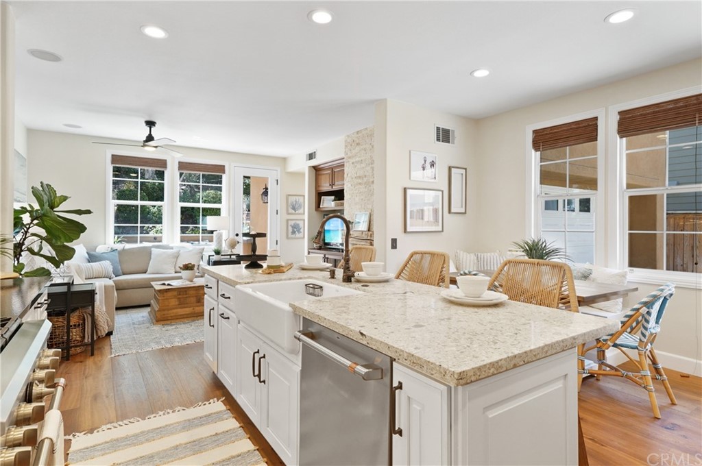56 Tuberose Street Ladera Ranch, CA 92694 - Photo 13 of 55 a view of a kitchen counter space and wooden floor