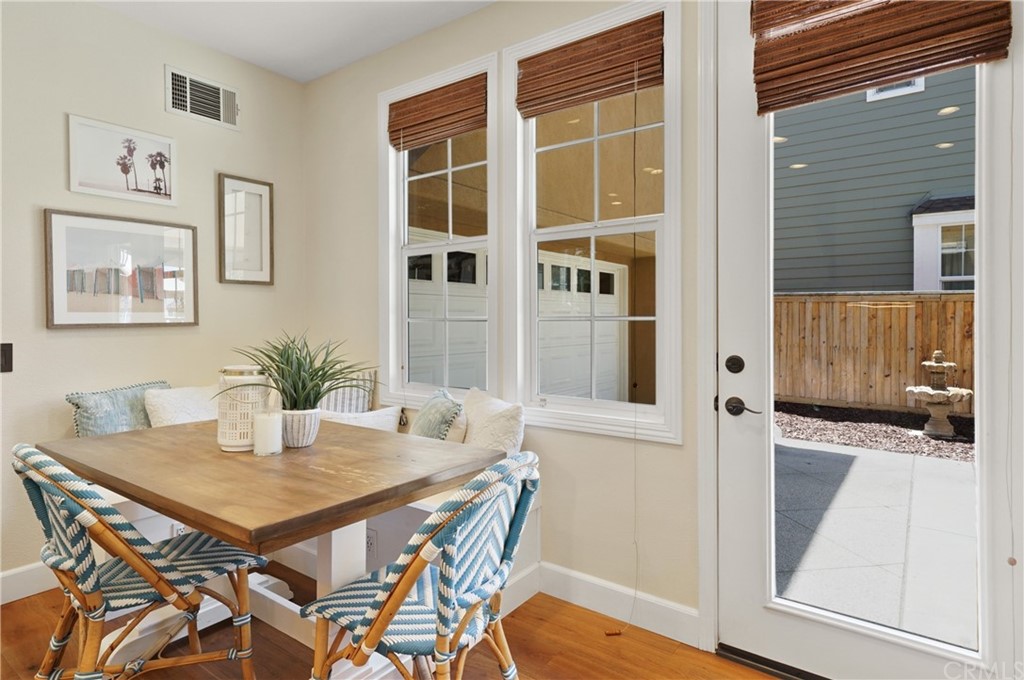 56 Tuberose Street Ladera Ranch, CA 92694 - Photo 18 of 55 a view of a dining room with furniture and wooden floor