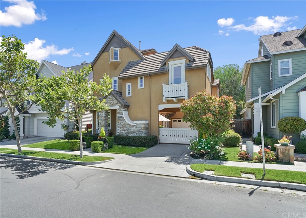 56 Tuberose Street Ladera Ranch, CA 92694 - Photo 2 of 55 a front view of a house with a yard and garage