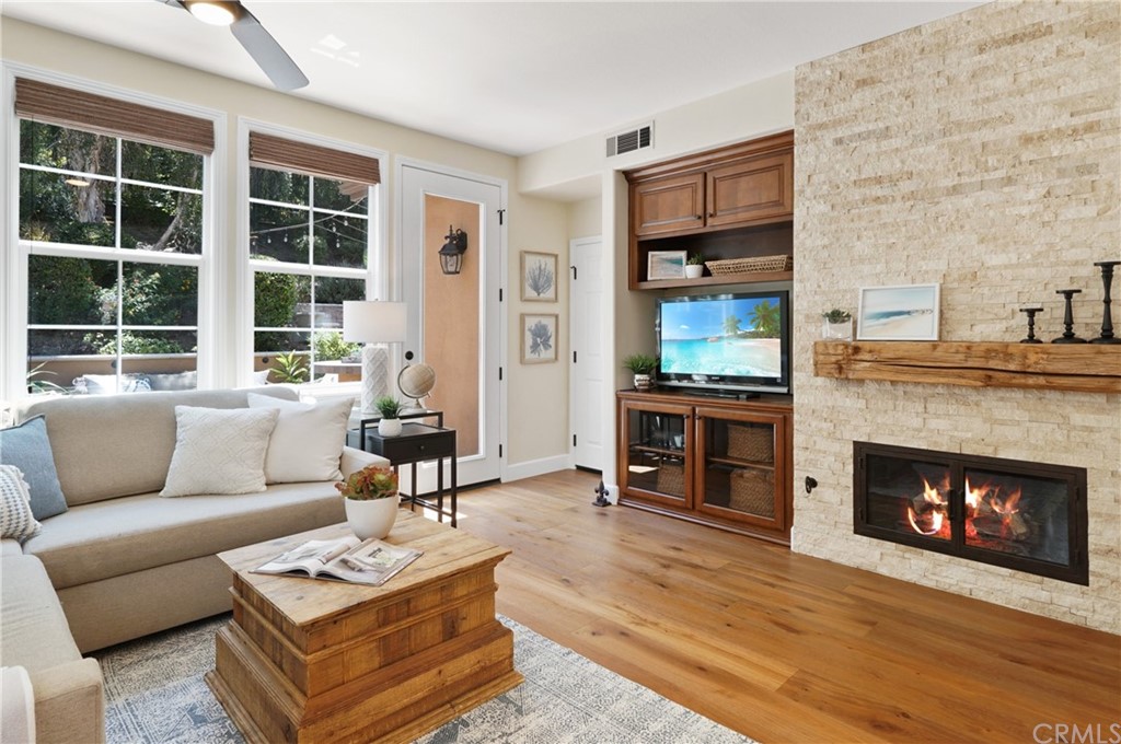 56 Tuberose Street Ladera Ranch, CA 92694 - Photo 21 of 55 a living room with furniture and a fireplace
