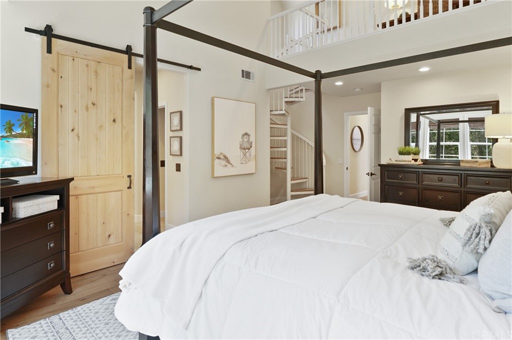 56 Tuberose Street Ladera Ranch, CA 92694 - Photo 36 of 55 a bedroom with a bed dresser and a window