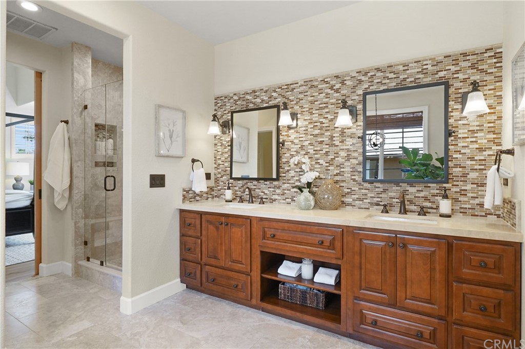 56 Tuberose Street Ladera Ranch, CA 92694 - Photo 37 of 55 a bathroom with a double vanity sink mirror and double