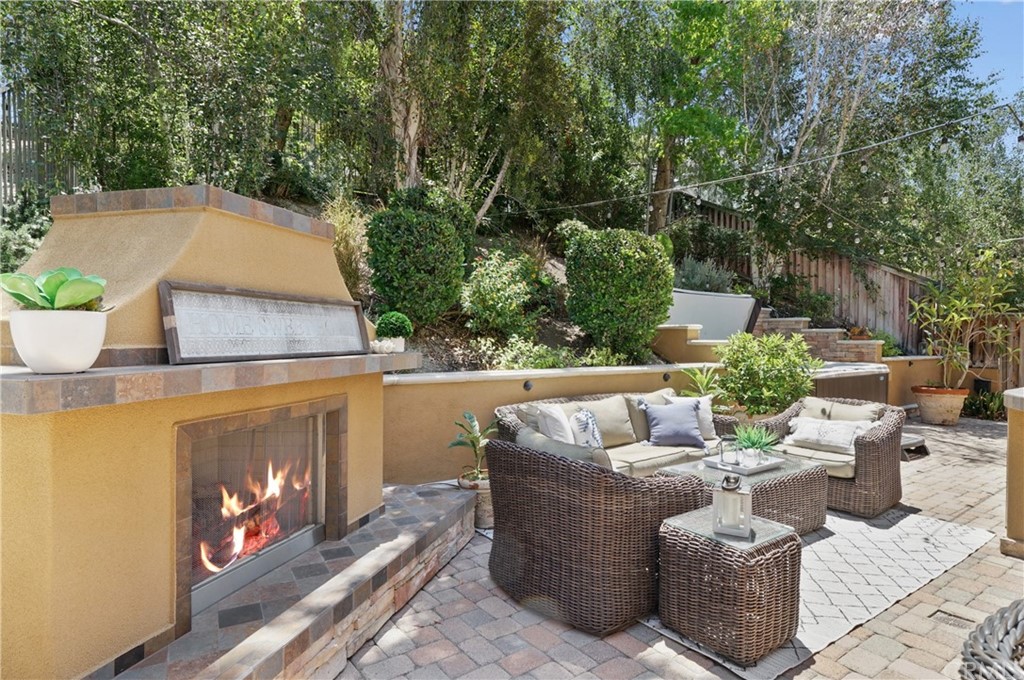 56 Tuberose Street Ladera Ranch, CA 92694 - Photo 47 of 55 a view of a patio with couches table and chairs with potted plants