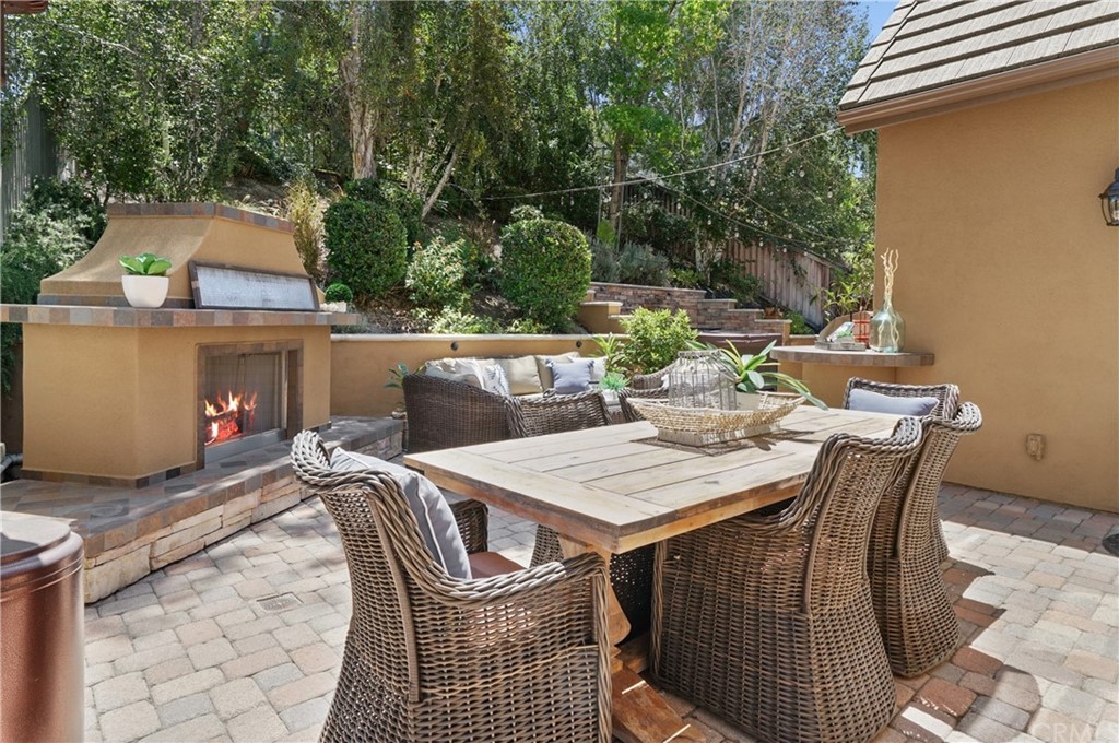56 Tuberose Street Ladera Ranch, CA 92694 - Photo 49 of 55 a view of a patio with a table and chairs