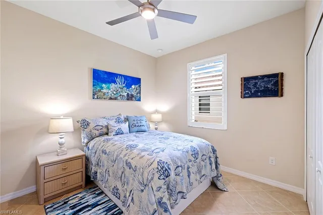 a bedroom with bed and a window