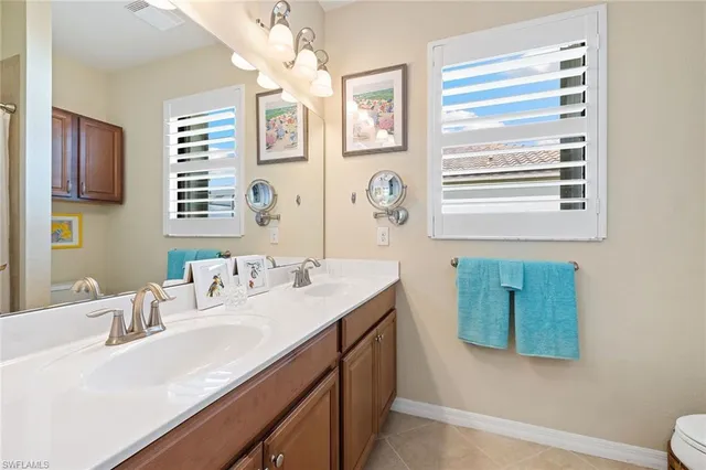 a bathroom with a sink double vanity and a mirror