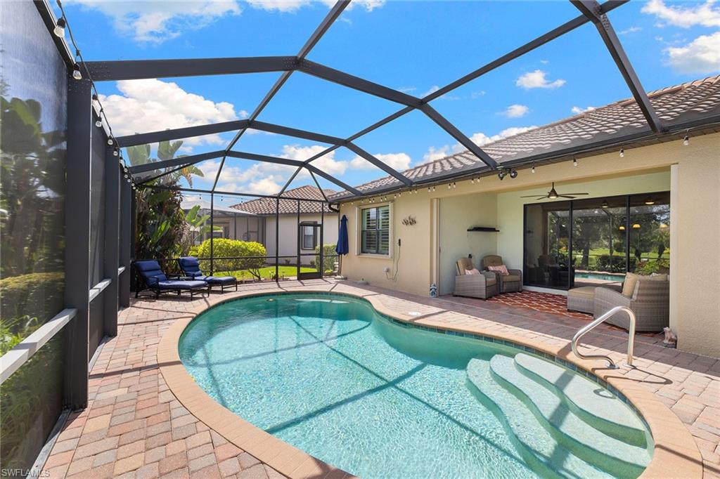 3837 Ruby Way Naples, FL 34114 - Photo 29 of 31 a view of a backyard with swimming pool
