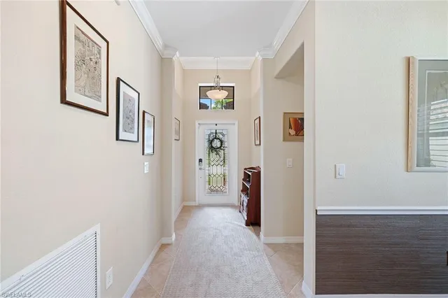 a view of a hallway with windows and closet