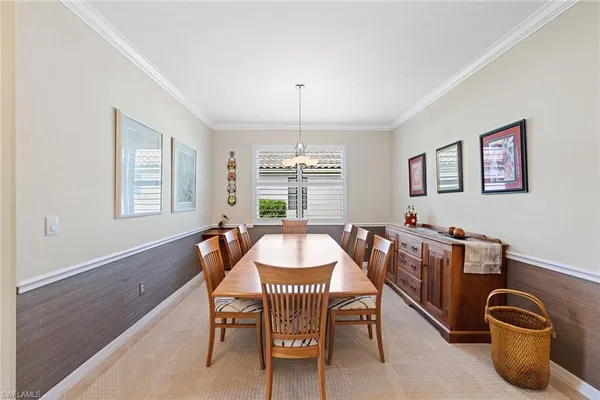a dining room with furniture and window