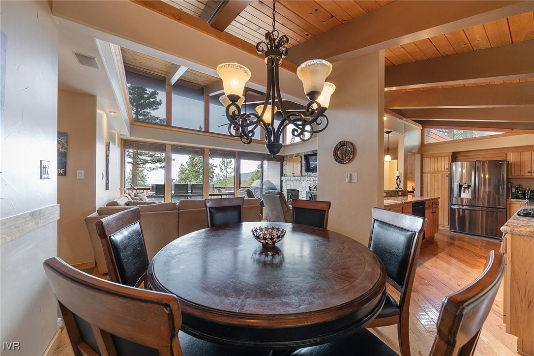 725 Fairview Boulevard, Unit 11 Incline Village, NV 89451 - Photo 13 of 45 a view of a dining room with furniture and chandelier