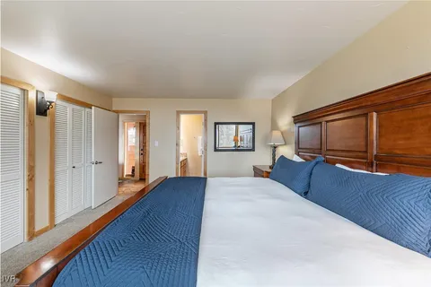 a view of a dining room with furniture and a flat screen tv