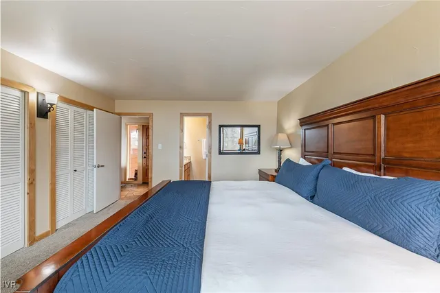 a view of a dining room with furniture and a flat screen tv