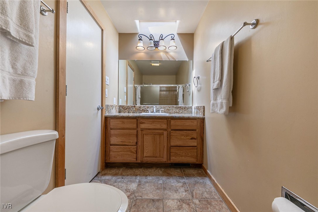 725 Fairview Boulevard, Unit 11 Incline Village, NV 89451 - Photo 19 of 45 a bathroom with a sink a mirror and a toilet
