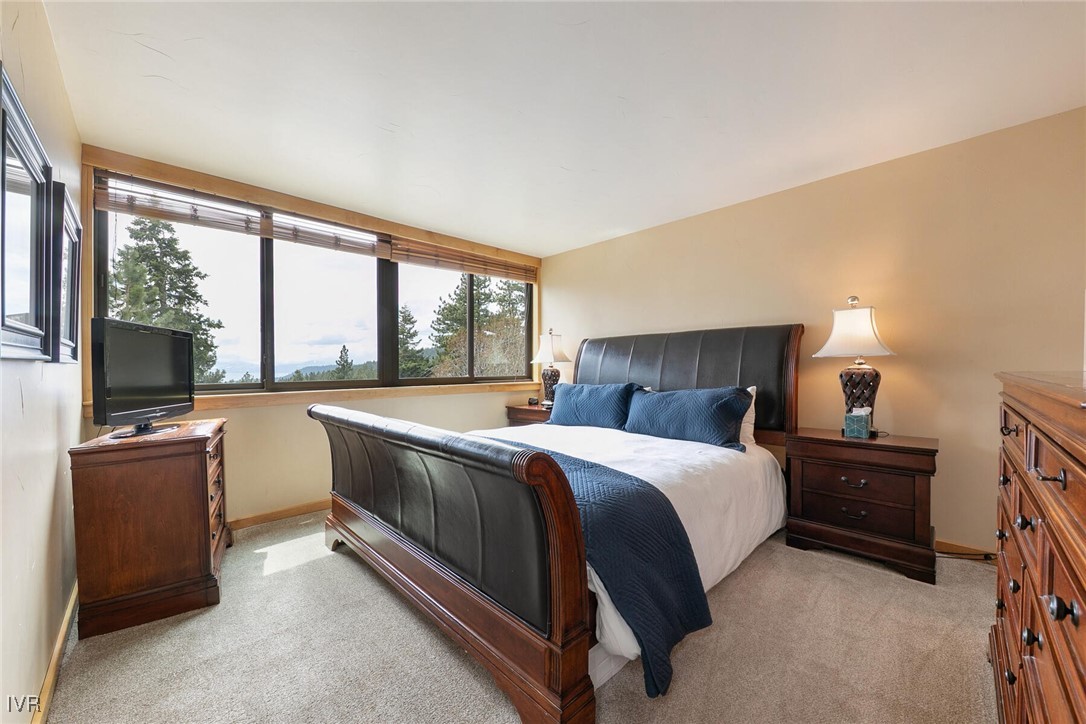 725 Fairview Boulevard, Unit 11 Incline Village, NV 89451 - Photo 20 of 45 a bed room with a bed and a television