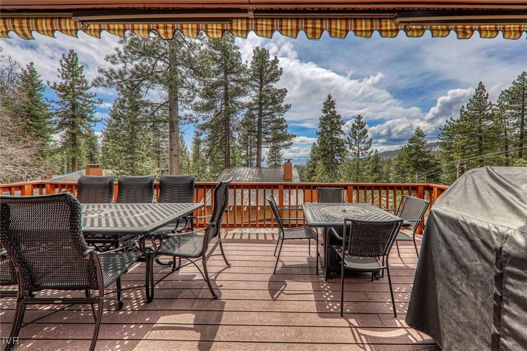 725 Fairview Boulevard, Unit 11 Incline Village, NV 89451 - Photo 2 of 45 a view of a chairs and table on the terrace