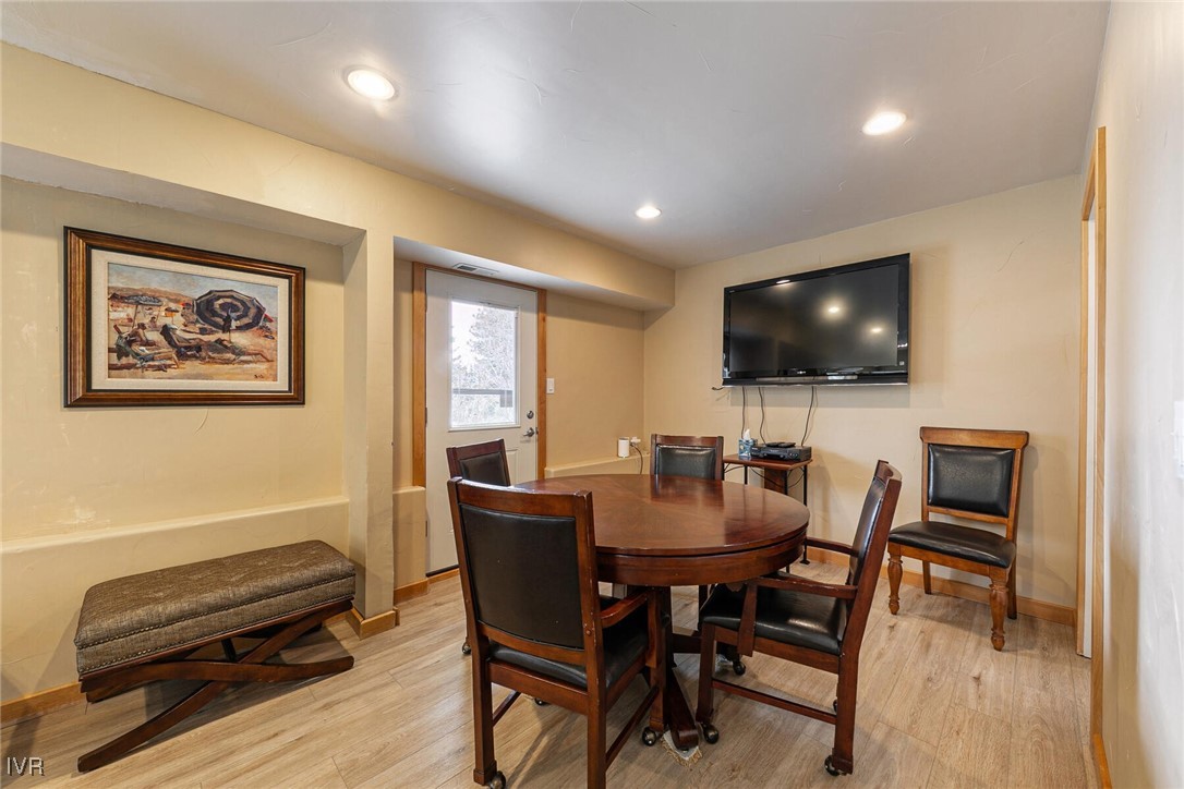 725 Fairview Boulevard, Unit 11 Incline Village, NV 89451 - Photo 25 of 45 a view of a dining room with furniture and a flat screen tv