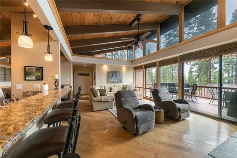 a view of a dining room with furniture window and outside view