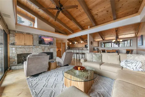 a large kitchen with stainless steel appliances granite countertop a stove and cabinets