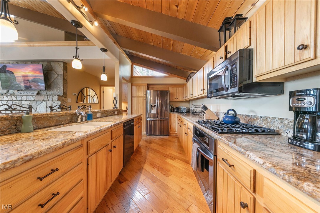 725 Fairview Boulevard, Unit 11 Incline Village, NV 89451 - Photo 10 of 45 a large kitchen with stainless steel appliances granite countertop a stove and cabinets