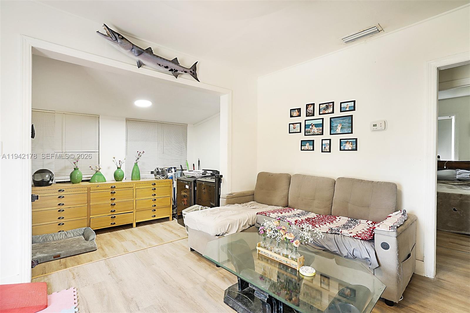 3021 Avenue J Riviera Beach, FL 33404 - Photo 13 of 17 a living room with furniture and painting on the wall