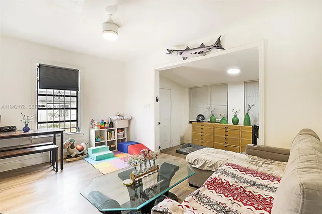 a bedroom with a bed window and couch