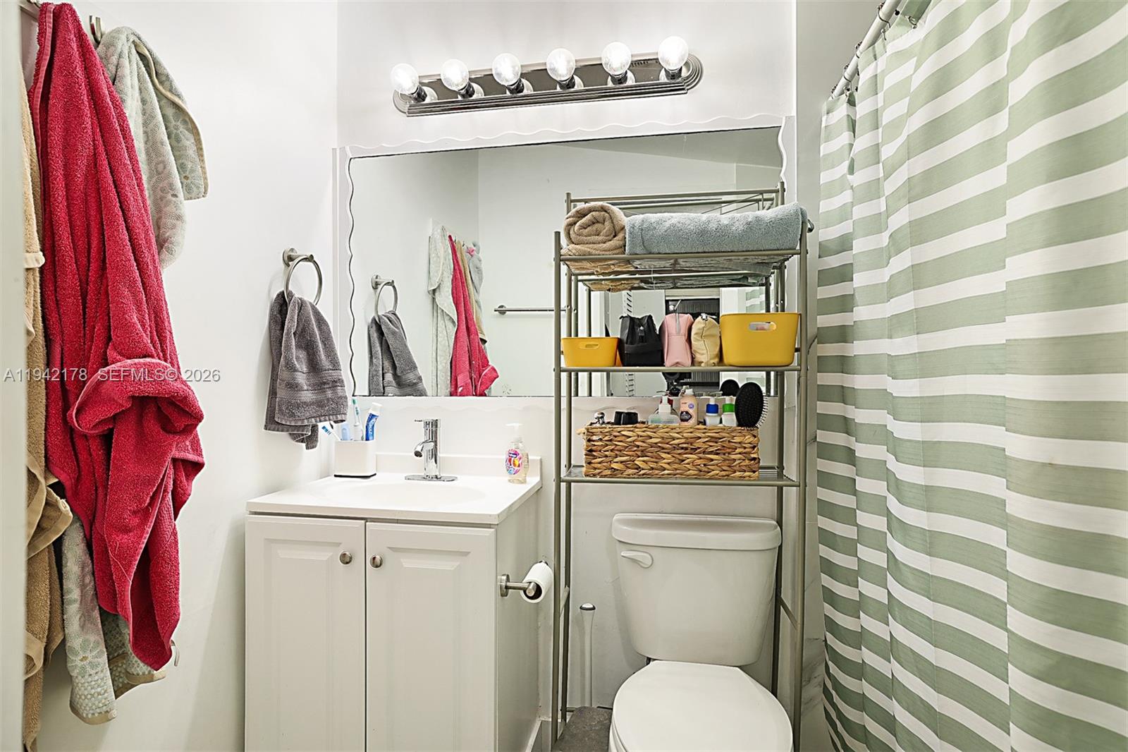 3021 Avenue J Riviera Beach, FL 33404 - Photo 16 of 17 a bathroom with a sink toilet and shower