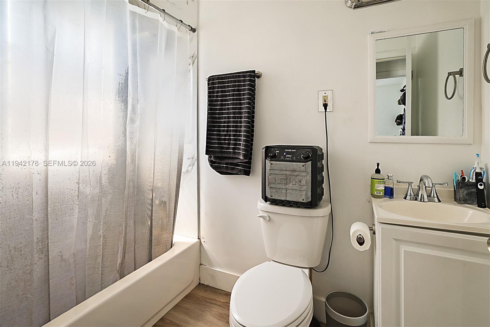 3021 Avenue J Riviera Beach, FL 33404 - Photo 17 of 17 a bathroom with a toilet a sink and tub