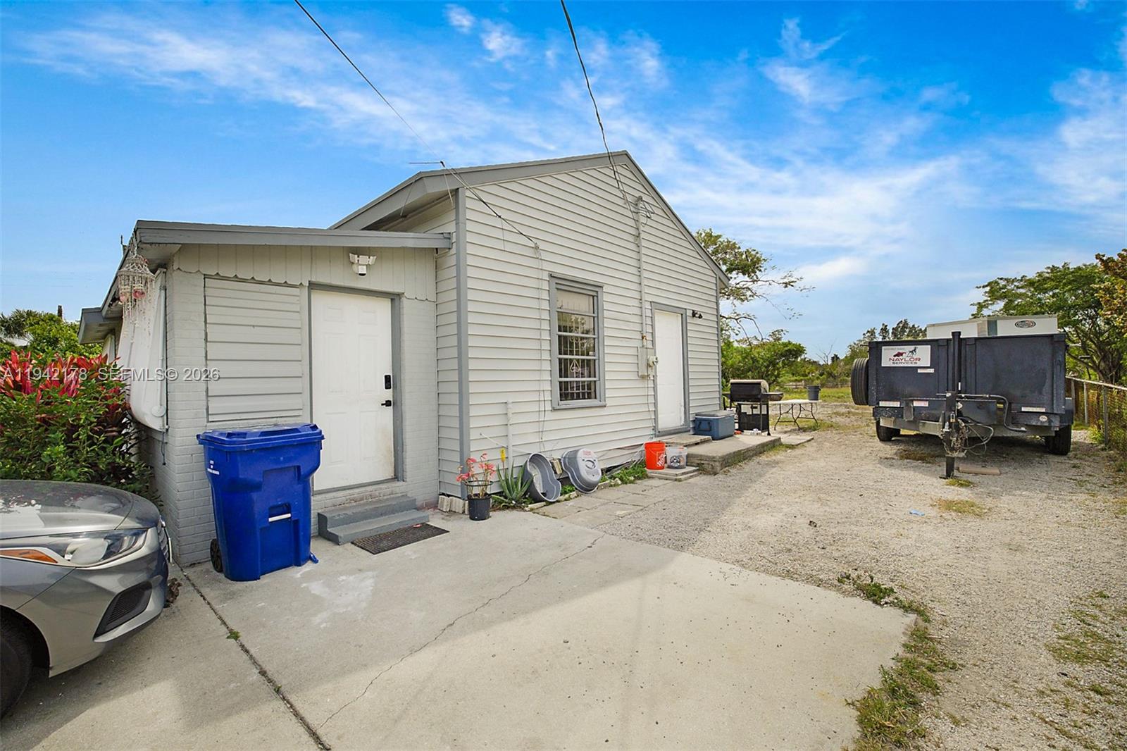 3021 Avenue J Riviera Beach, FL 33404 - Photo 2 of 17 a view of a house with a patio