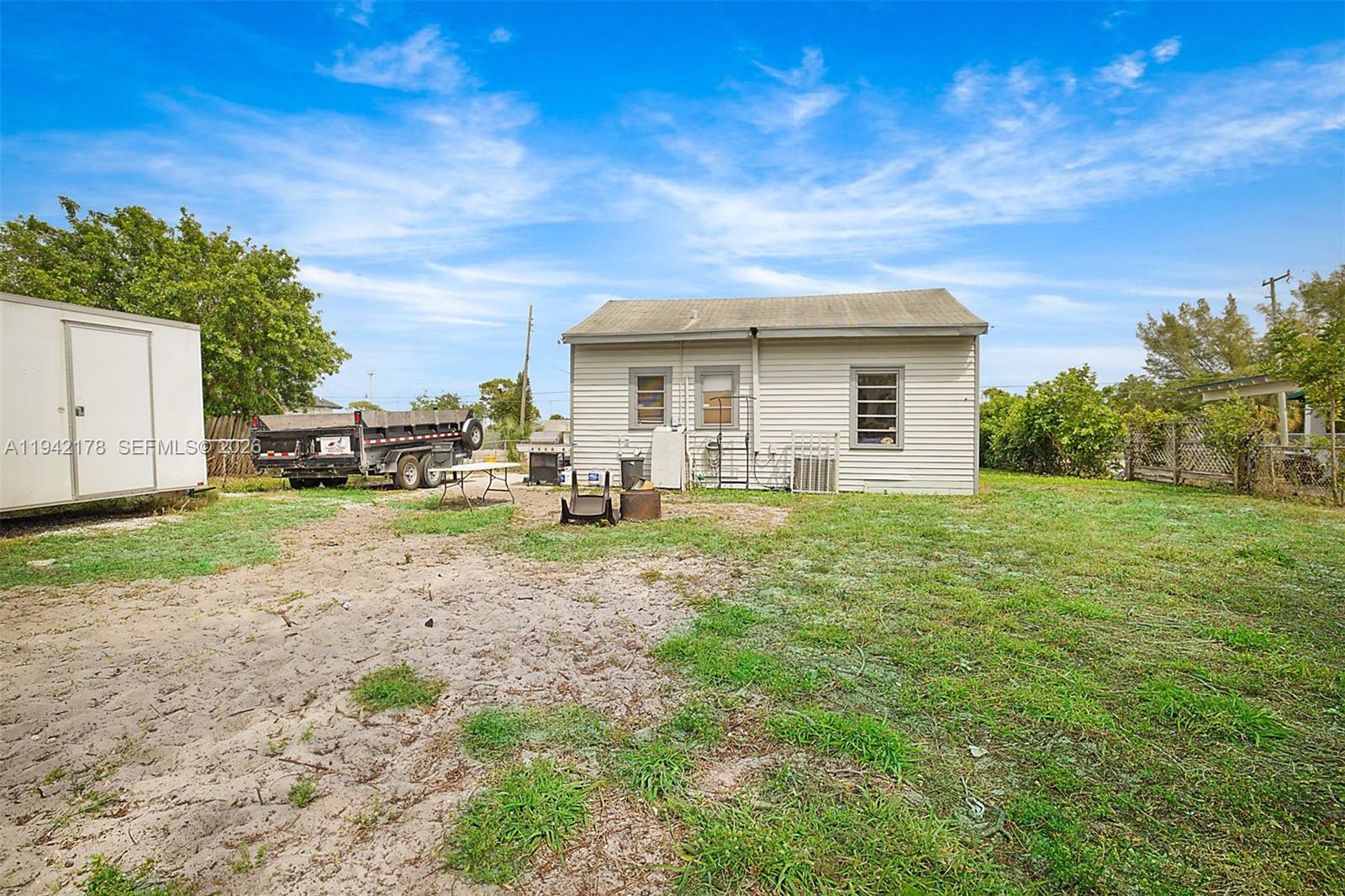 3021 Avenue J Riviera Beach, FL 33404 - Photo 4 of 17 a view of a house with a backyard