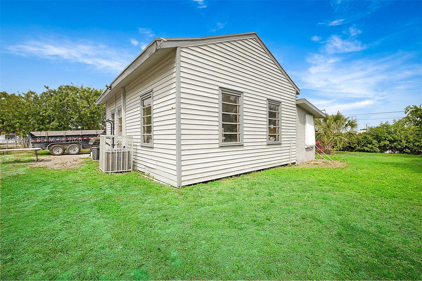 3021 Avenue J Riviera Beach, FL 33404 - Photo 5 of 17 a view of a house with a backyard