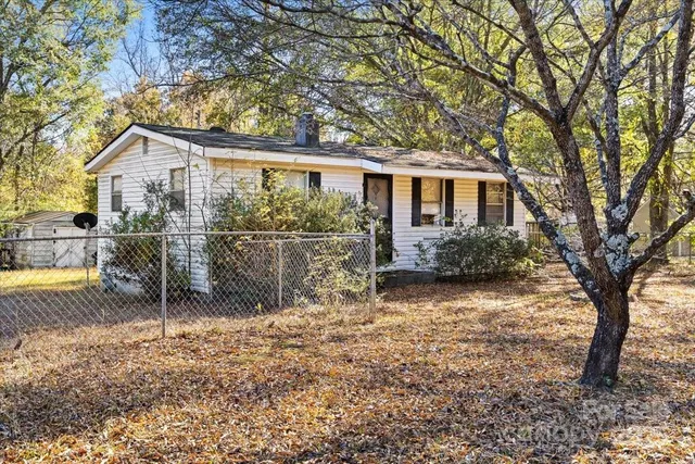 a backyard of a house with seating space