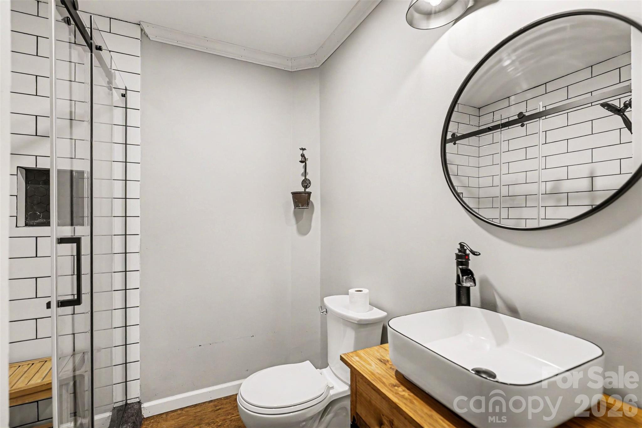184 Canal Road Belmont, NC 28012 - Photo 29 of 39 a bathroom with a toilet a sink and a mirror
