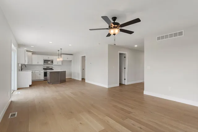 a view of a kitchen with a sink and cabinet area