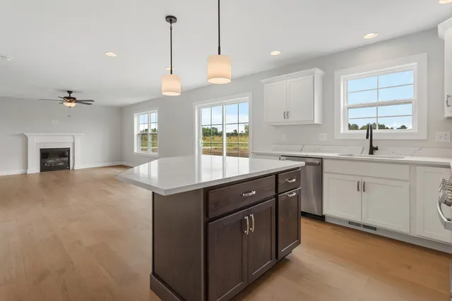 a kitchen with a sink stove and window