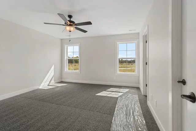 a view of livingroom with hardwood floor and a ceiling fan