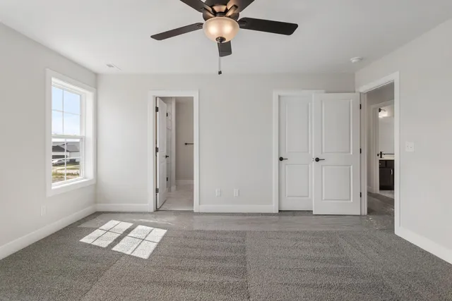 a view of livingroom with window ceiling fan