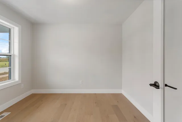a view of a room that has a window in it