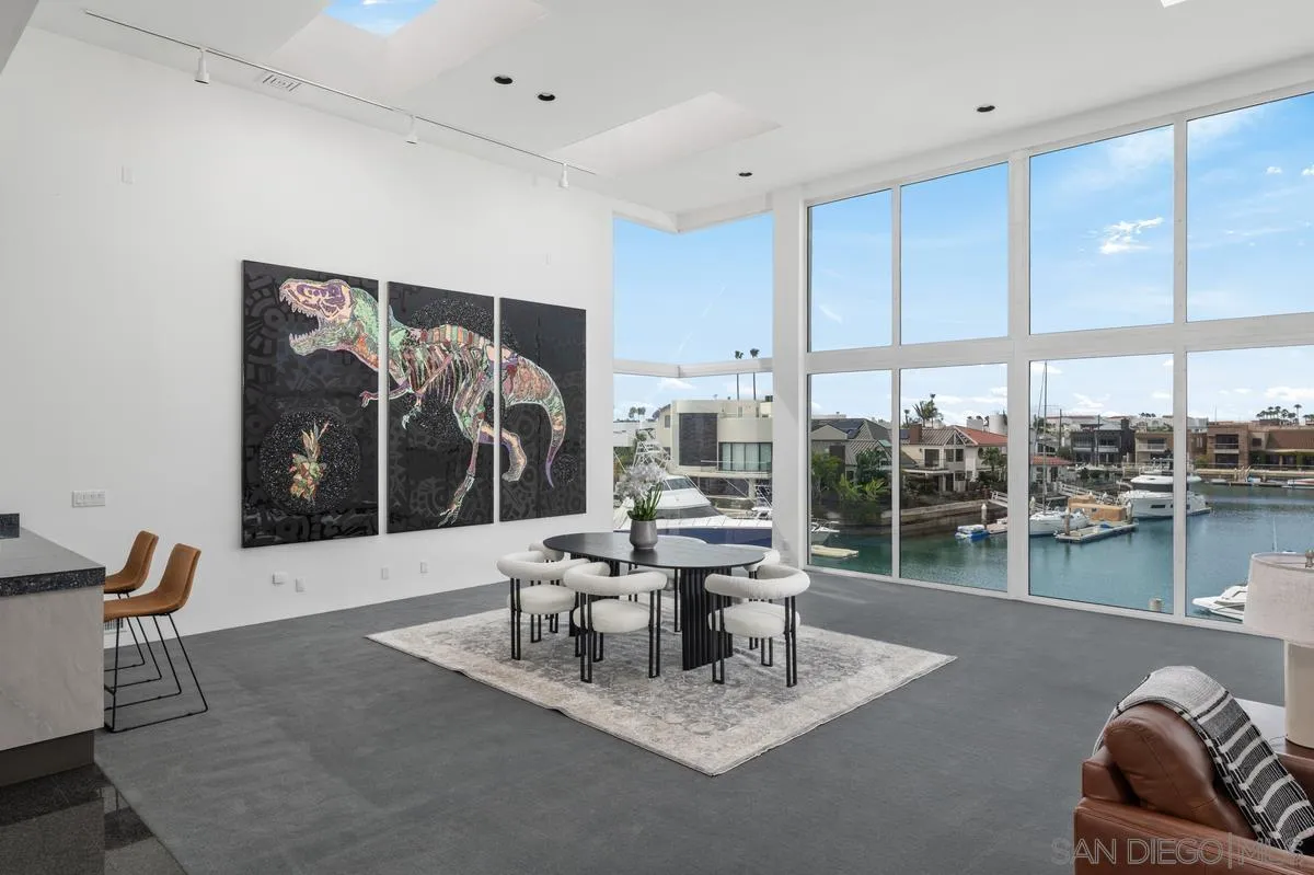 25 Green Turtle Road Coronado, CA 92118 - Photo 13 of 51 a living room with furniture and a floor to ceiling window