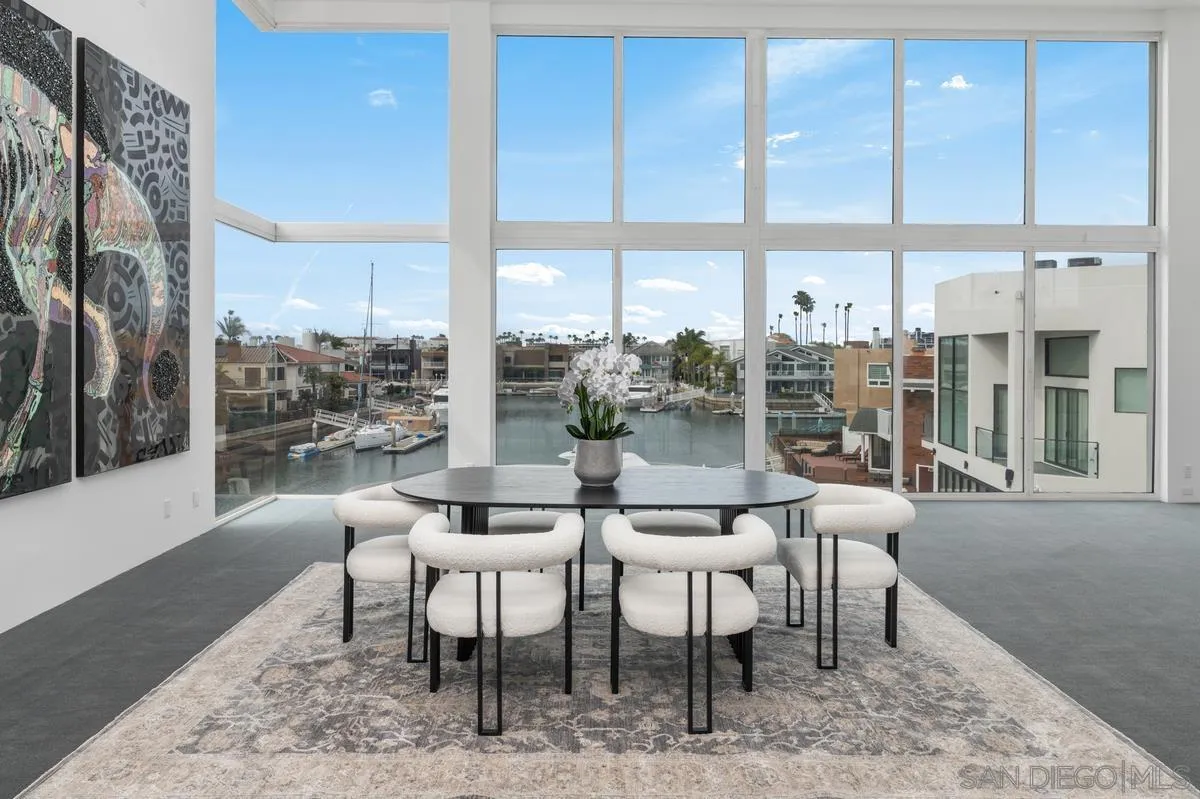 25 Green Turtle Road Coronado, CA 92118 - Photo 18 of 51 a dining room with furniture a rug and a large window