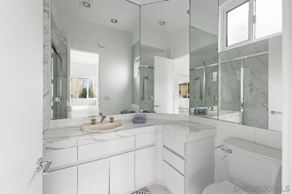 25 Green Turtle Road Coronado, CA 92118 - Photo 34 of 51 a bathroom with a sink and a mirror