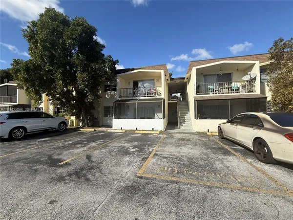 a view of a car park in front of house
