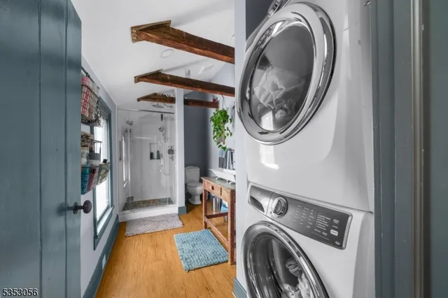 a view of a storage & utility room with a washer dryer
