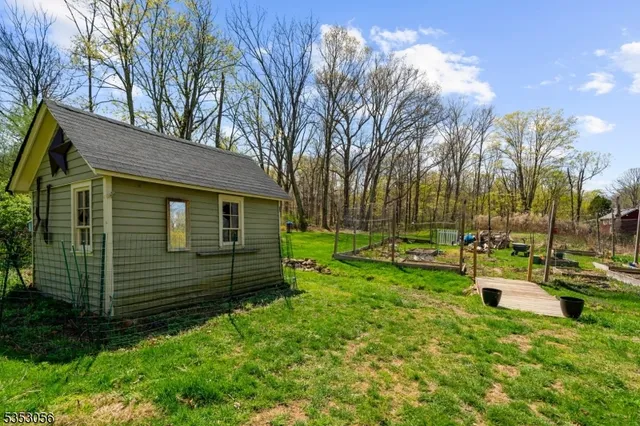 a view of a backyard with sitting area