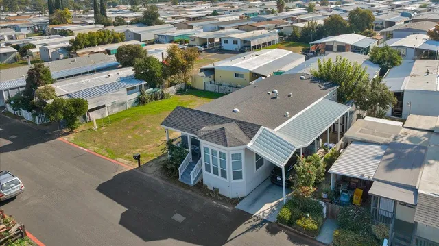 an aerial view of a house with a ocean view